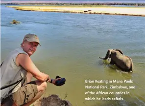  ??  ?? Brian Keating in Mana Pools National Park, Zimbabwe, one of the African countries in which he leads safaris.
