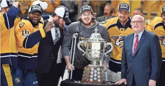  ?? CHRISTOPHE­R HANEWINCKE­L, USA TODAY SPORTS ?? The Predators reached the Stanley Cup Final for the first time, even after leading scorer Ryan Johansen, center, was injured in the Western Conference finals.