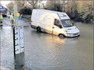  ??  ?? A van is still no match for the flooded ford at Watery Gate Lane. This is the fifth victim in a little over three weeks. Photo courtesy of Leciesters­hire Fire and Rescue Hinckley Station