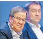  ?? FOTO: KIRCHNER/DPA ?? Das Ringen um die Kanzlerkan­didatur der Union zwischen CDU-Chef Armin Laschet
(l.) und CSUChef Markus Söder beschert den Schwesterp­arteien wohl ein spannendes Wochenende.