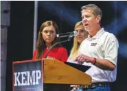 ?? CLAY TEAGUE/THE MACON TELEGRAPH VIA AP ?? Gov. Brian Kemp announces his bid for re-election at the Georgia National Fairground­s on July 10 in Perry, Ga.