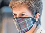  ?? Picture: PA. ?? Nicola Sturgeon wearing a tartan face mask during a visit to New Look at Ford Kinnaird retail park in Edinburgh.