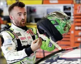  ?? JOHN RAOUX — THE ASSOCIATED PRESS ?? Austin Dillon prepares his helmet before a NASCAR auto racing practice at Daytona Internatio­nal Speedway in Daytona Beach, Fla.