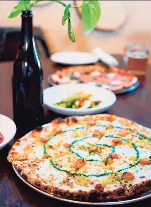  ?? Courtesy of New Park Brewing ?? Patty’s at New Park Brewing in West Hartford offers wood-fired pizzas, small plates and natural wines.