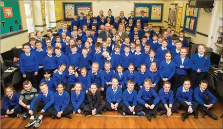  ??  ?? On behalf of the pupils of St Teresa’s NS Kilflynn on Wednesday principal Ide Brosnan presented Mike Leen (caretaker) with a special gift to mark his retirement from been caretaker at the school after many years.