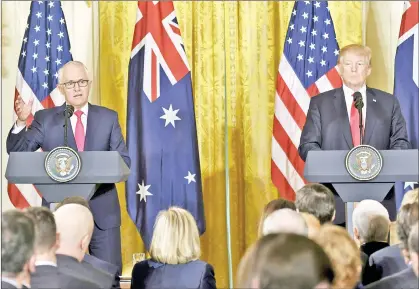  ??  ?? Turnbull (left) speaks during a joint press conference with Trump in the East Room of the White House in Washington, DC. — AFP photo