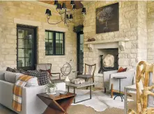  ?? EMILY FOLLOWILL ?? Designer James Wheeler blurred the lines between indoor and outdoor in the design of this covered terrace for the 2015 Atlanta Homes & Lifestyles Home for the Holidays Showhouse. It features an antique lion’s head fountain in the fireplace that is...