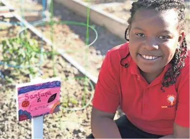  ?? KRISTINE M. KIERZEK ?? Santana Webb, 9, asked to have her own garden plot.