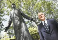  ??  ?? Supreme Knight Carl A. Anderson in front of a statue of the Rev. Michael McGivney at the Knights of Columbus headquarte­rs in New Haven on Wednesday.