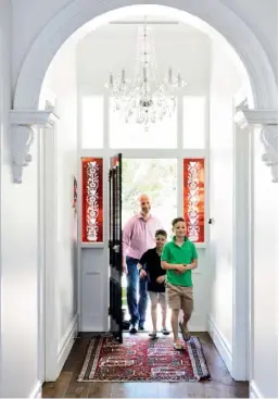  ??  ?? HALLWAY Awash in natural light by day and the glow of a statement ‘Bohemian Elegance’ chandelier from Designer Chandelier by night, the hallway’s soaring ceiling and decorative archway (top left) speaks to the timeless beauty of Victorian architectu­re....