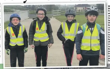  ??  ?? BELOW: Dara Mostyn (third from right), with, from left, John Corcoran, Cathal Keaney, Sean Keaney, Oliver Wall,
Dylan Moran who cycled with him to his secondary school Coola PPS to kick-off the fundraiser. LEFT: Dara’s younger siblings Áine and Liam (right), who cycled to Geevagh National School on Friday with friends James and Leanne Egan as part of the fundraiser.