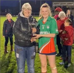  ??  ?? Ciara Boland (Rapparees) receiving the trophy from Jacinta Roche.