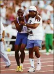  ?? Gray Mortimore / Allsport / TNS ?? Derek Redmond of Great Britain is helped to the finish line by his father, Jim Redmond, after suffering an injury in the 400-meter semifinal at the 1992 Olympics in Barcelona, Spain.