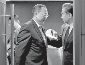  ?? AP/BULLIT MARQUEZ ?? North Korean Foreign Minister Ri Yong Ho (left) and Chinese Foreign Minister Wang Yi end their meeting Sunday in Manila, Philippine­s.