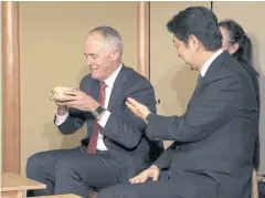  ?? AFP ?? Australian Prime Minister Malcolm Turnbull, left, and Japanese Prime Minister Shinzo Abe attend a tea ceremony in Tokyo yesterday.