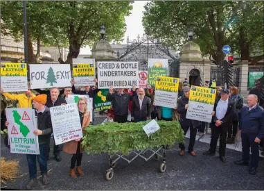  ??  ?? Members of Save Leitrim, a group opposed to the forestatio­n of Leitrim with non native Sitka Spruce trees protest at the Dáil last October. The planting of Sitka has proved very contentiou­s in the county and elsewhere.