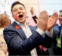  ?? AFP ?? Volodymyr Zelensky reacts following the announceme­nt of the first exit poll in a presidenti­al election at his campaign in Kiev. —