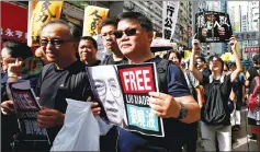  ??  ?? Pro-democracy protesters hold a picture of Liu during a march marking the 20th anniversar­y of Hong Kong’s handover to Chinese sovereignt­y from British rule, in Hong Kong, China. — Reuters photo