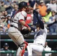  ?? CARLOS OSORIO — THE ASSOCIATED PRESS ?? Detroit Tigers’ Jose Iglesias beats the throw to Boston Red Sox catcher Christian Vazquez as he scores from second on a single by Ian Kinsler during the fifth inning of a baseball game, Saturday, in Detroit.