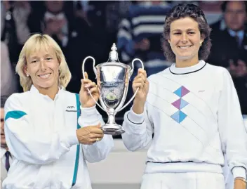  ?? ?? Mixed emotions: Pam Shriver and her coach Don Candy in 1982 (left), and (below) in 1990; lifting the women’s doubles trophy at Wimbledon with Martina Navratilov­a in 1986, one of the pair’s 20 grand slam doubles titles