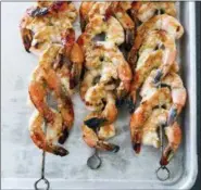  ??  ?? JOE KELLER/AMERICA’S TEST KITCHEN VIA ASSOCIATED PRESSThis undated photo provided by America’s Test Kitchen shows grilled jalapeno and lime shrimp skewers in Brookline, Mass.