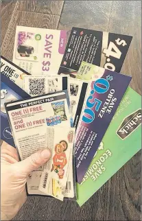  ?? ROSIE MULALEY/THE TELEGRAM ?? Tina Crane shows a handful of coupons.