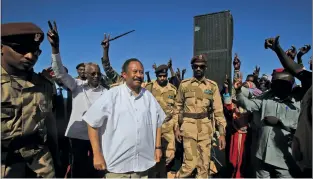  ??  ?? Above: Sudan’s Prime Minister Abdalla Hamdok is greeted by supporters in North Darfur state.