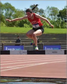  ??  ?? Róisín O’Reilly of Menapians who won the Junior 3,000m steeplecha­se at her first attempt.