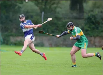  ??  ?? Barndarrig’s Malachy Stone is closed down by Kilcoole’s Kris Farrell.