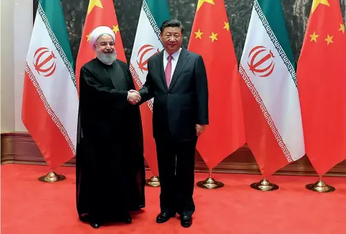  ??  ?? Les présidents Xi Jinping et Hassan Rohani