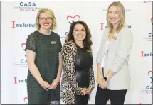  ?? (NWA Democrat-Gazette/Carin Schoppmeye­r) ?? Amanda Wilkerson (from left); Crystal Vickmart, CASA Northwest Arkansas executive director; and Ryan Brashears welcome supporters to the Light of Hope luncheon Nov. 3 at the Northwest Arkansas Convention Center in Springdale.