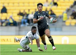  ?? GETTY IMAGES ?? Salesi Rayasi makes a break for the Hurricanes during their 67-5 Super Rugby Pacific win over Fijian Drua in Wellington yesterday.