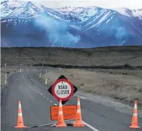  ??  ?? Wide perimeter . . . Lake Ohau Rd was closed to all but a steady stream of emergency service vehicles yesterday.