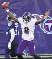  ?? ANDY LYONS GETTY IMAGES ?? Ravens quarterbac­k Lamar Jackson celebrates his 48-yard touchdown run against the Titans.