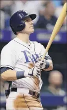  ?? Chris O’meara / Associated Press ?? Tampa Bay’s Jake Bauers watches his three-run home run off Oakland reliever Jeurys Familia in the eighth inning on Saturday night in Florida.