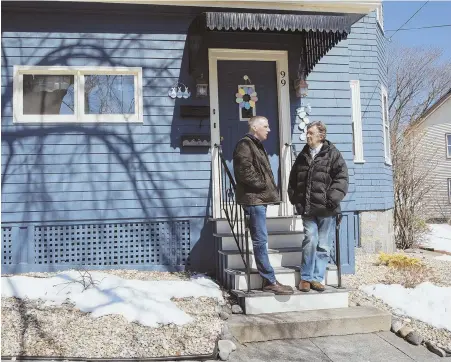  ?? STAFF PHOTOS BY NICOLAUS CZARNECKI ?? ‘SECOND CHANCE’: Tim Cahill, left, and John Nucci speak outside of Nucci’s home in East Boston yesterday, after Cahill wrote Nucci a letter about his own lifechangi­ng experience with a kidney transplant.