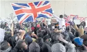  ?? AP ?? British activists join migrants in a clash with French anti-riot police in the Calais ‘Jungle’ camp on Saturday.
