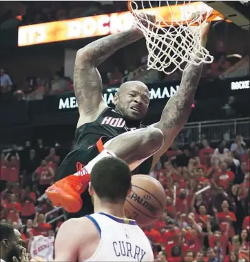  ?? Ronald Martinez Getty Images ?? HOUSTON’S P.J. Tucker dunks with authority during the the first half, when the Rockets took a 64-50 lead.