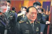  ?? AP ?? Gen Wei Fenghe (centre) walks out after a meeting with Lloyd J Austin in Siem Reap, Cambodia, on Tuesday.