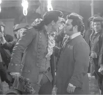  ?? DISNEY ?? Luke Evans as Gaston, left, with Josh Gad as LeFou in Beauty and the Beast. The film has sparked opposition in some quarters for featuring LeFou as the first gay character in a Disney film.