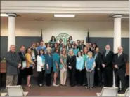  ?? NICHOLAS BUONANNO — NBUONANNO@TROYRECORD.COM ?? Officials from the town of East Greenbush along with officials from East Greenbush Central School District collaborat­e together to help turn the town teal for ovarian cancer awareness.