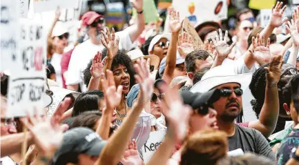  ?? Elizabeth Conley / Houston Chronicle ?? Protesters by the thousands turned out in Houston and hundreds of other U.S. cities for immigratio­n rallies. Stories on pages A2, A3.