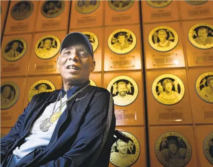  ?? 2018 U-T FILE PHOTO ?? Two-time Olympic medalist Arnie Robinson, sitting in front of his plaque at Breitbard Hall of Fame at Petco Park, died Tuesday.