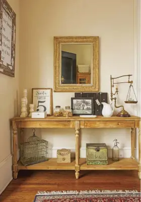  ??  ?? (left) Vintage finds and period items, like the pieces here, continue the integrity of the early 1900s when the home was built. Leslie and her husband sought to carry this time period throughout the home during the renovation process. (bottom left) This piece is Leslie’s favorite. It’s an old general store counter, and she had been looking for something like it for a long time. “When I found it, I cried,” she says.