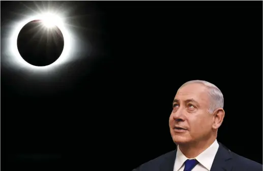  ?? (Reuters) ?? PRIME MINISTER Benjamin Netanyahu looks skywards on a June visit to a synagogue in Thessaloni­ki, Greece. Two months later, a heavenly image is captured of Monday’s solar eclipse creating a diamond ring effect in the sky, in the Great Smoky Mountains...