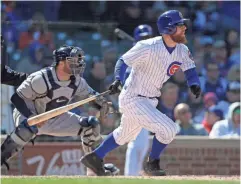  ?? DENNIS WIERZBICKI/ USA TODAY SPORTS ?? Cubs second baseman Ben Zobrist says he has worn black spikes at Wrigley Field for day games ‘to pay homage to the history of our great game.’