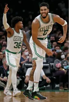  ?? STUART CAHILL / HERALD STAFF ?? GETTING READY: Jayson Tatum celebrates making a 3pointer during Saturday night’s preseason win over the Toronto Raptors at the Garden.