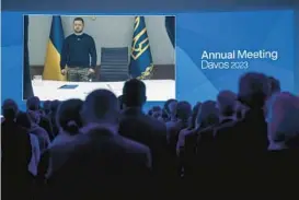  ?? FABRICE COFFRINI/GETTY-AFP ?? Ukrainian President Volodymyr Zelenskyy speaks via video link to an audience attending the World Economic Forum on Wednesday in Davos, Switzerlan­d.