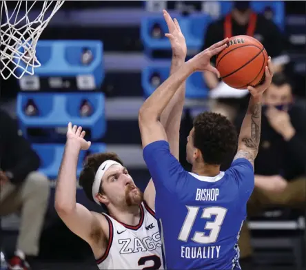  ?? AJ MAST - THE ASSOCIATED PRESS ?? Creighton forward Christian Bishop (13) drives on Gonzaga forward Drew Timme (2) in the first half of a Sweet 16 game in the NCAA men’s college basketball tournament at Hinkle Fieldhouse in Indianapol­is, Sunday, March 28, 2021.