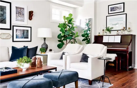  ??  ?? ABOVE & BELOW The bright and eclectic living room is a lesson in layering done right. Crisp white walls are warmed by rich hits of blue, lush greenery and a whimsical collection of artwork and objets like homeowner Alex Luby’s exquisite vintage oil...